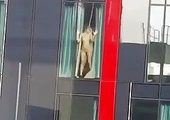 Hotel window exhibitionist