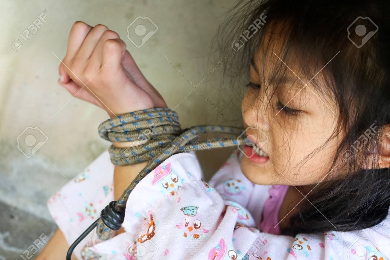 Asian girl hands tied over head