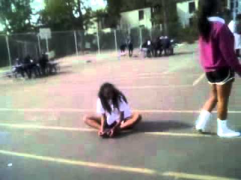Girl peeing on ground
