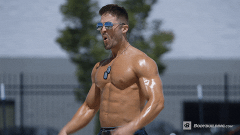 Bodybuilder flexes poses naked outside