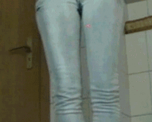 Skinny girl peeing jeans